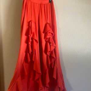 Red flared stretchy ruffle pants with slits